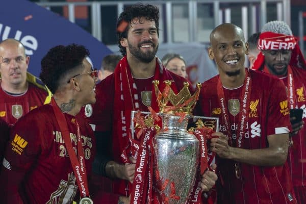 LIVERPOOL, ENGLAND - Wednesday, July 22, 2020: Liverpool's goalkeeper Alisson Becker (C) celebrates with team-mates Roberto Firmino (L) and Fabio Henrique Tavares 'Fabinho' (R) and the Premier League trophy as the Reds are crowned Champions after the FA Premier League match between Liverpool FC and Chelsea FC at Anfield. The game was played behind closed doors due to the UK government’s social distancing laws during the Coronavirus COVID-19 Pandemic. (Pic by David Rawcliffe/Propaganda)