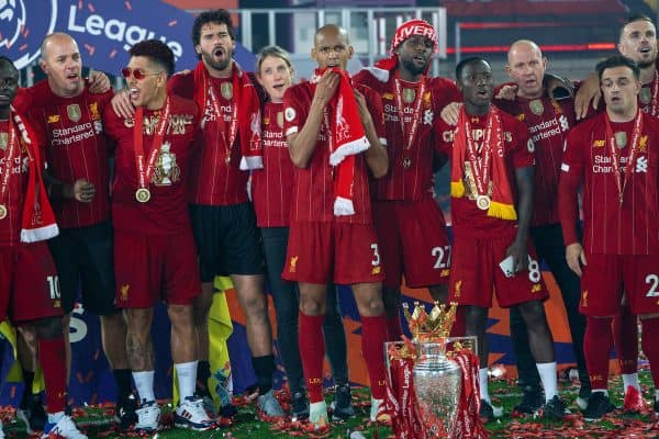 LIVERPOOL, ENGLAND - Wednesday, July 22, 2020: Liverpool players celebrate with the Premier League trophy as they sing "You'll Never Walk Alone" after being crowned Champions after the FA Premier League match between Liverpool FC and Chelsea FC at Anfield. The game was played behind closed doors due to the UK government’s social distancing laws during the Coronavirus COVID-19 Pandemic. Roberto Firmino, goalkeeper Alisson Becker, head of nutrition Mona Nemmer, Fabio Henrique Tavares 'Fabinho', Divock Origi, Naby Keita, Xherdan Shaqiri. (Pic by David Rawcliffe/Propaganda)