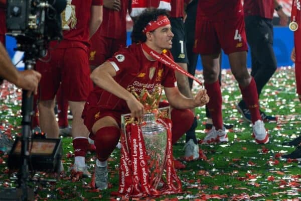 LIVERPOOL, ENGLAND - Wednesday, July 22, 2020: Liverpool’s Curtis Jones celebrates with the Premier League trophy and his winners' medal as the Reds are crowned Champions after the FA Premier League match between Liverpool FC and Chelsea FC at Anfield. The game was played behind closed doors due to the UK government’s social distancing laws during the Coronavirus COVID-19 Pandemic. Liverpool won 5-3. (Pic by David Rawcliffe/Propaganda)