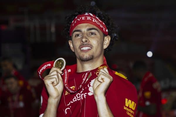 LIVERPOOL, ENGLAND - Wednesday, July 22, 2020: Liverpool’s Curtis Jones bites his winners' medal as the Reds are crowned Champions after the FA Premier League match between Liverpool FC and Chelsea FC at Anfield. The game was played behind closed doors due to the UK government’s social distancing laws during the Coronavirus COVID-19 Pandemic. (Pic by David Rawcliffe/Propaganda)