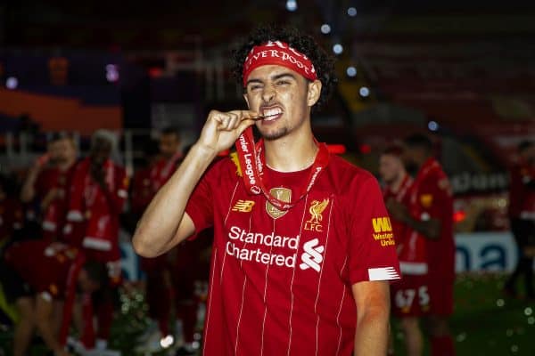 LIVERPOOL, ENGLAND - Wednesday, July 22, 2020: Liverpool's Curtis Jones bites his winners' medal after the Reds are crowned Champions after the FA Premier League match between Liverpool FC and Chelsea FC at Anfield. The game was played behind closed doors due to the UK government’s social distancing laws during the Coronavirus COVID-19 Pandemic. Liverpool won 5-3. (Pic by David Rawcliffe/Propaganda)