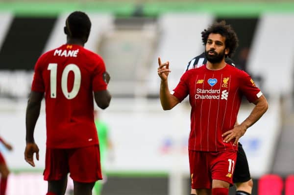 LIVERPOOL, ENGLAND - Sunday, July 26, 2020: Liverpool’s Mohamed Salah (R) speaks with team-mate Sadio Mané during the final match of the FA Premier League season between Newcastle United FC and Liverpool FC at St. James' Park. The game was played behind closed doors due to the UK government’s social distancing laws during the Coronavirus COVID-19 Pandemic. Liverpool won 3-1 and finished the season as Champions on 99 points. (Pic by Propaganda)