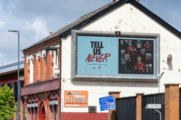 LIVERPOOL, ENGLAND - Monday, August 3, 2020: A Nike advert "Tell Us Never" is shown on a hording on The Albert pub oustide Liverpool's Spion Kop at Anfield. Liverpool's new kit supplier Nike replaces New Balance in a five year deal reported to be worth $39.5 per year. (Pic by David Rawcliffe/Propaganda)