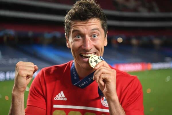 LISBON, PORTUGAL - Sunday, August 23, 2020: FC Bayern Munich’s Robert Lewandowski bites his winners’ medal after the UEFA Champions League Final between FC Bayern Munich and Paris Saint-Germain at the Estadio do Sport Lisboa e Benfica. FC Bayern Munich won 1-0. (Credit: ©UEFA)