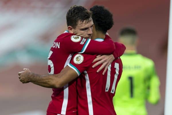 LIVERPOOL, ENGLAND - Saturday, September 12, 2020: Liverpool’s Mohamed Salah (R) celebrates with team-mate Andy Robertson (L) after scoring the winning fourth goal, his hat-trick, from a penalty-kick to make the score 4-3 during the opening FA Premier League match between Liverpool FC and Leeds United FC at Anfield. The game was played behind closed doors due to the UK government’s social distancing laws during the Coronavirus COVID-19 Pandemic. Liverpool won 4-3. (Pic by David Rawcliffe/Propaganda)