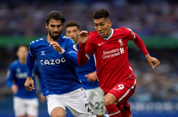 LIVERPOOL, ENGLAND - Saturday, October 17, 2020: Liverpool’s Roberto Firmino (R) gets away from Everton's André Gomes during the FA Premier League match between Everton FC and Liverpool FC, the 237th Merseyside Derby, at Goodison Park. The game was played behind closed doors due to the UK government’s social distancing laws during the Coronavirus COVID-19 Pandemic. The game ended in a 2-2 draw. (Pic by David Rawcliffe/Propaganda)