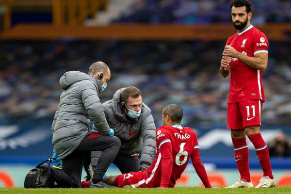 LIVERPOOL, ENGLAND - Saturday, October 17, 2020: Liverpool’s Thiago Alcantara is treated for an injury by physio Chris Morgan during the FA Premier League match between Everton FC and Liverpool FC, the 237th Merseyside Derby, at Goodison Park. The game was played behind closed doors due to the UK government’s social distancing laws during the Coronavirus COVID-19 Pandemic. The game ended in a 2-2 draw. (Pic by David Rawcliffe/Propaganda)