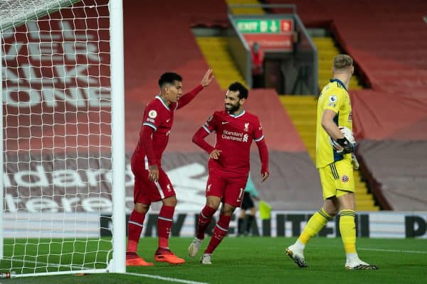 LIVERPOOL, ENGLAND - Saturday, October 24, 2020: Liverpool’s Roberto Firmino (L) celebrates with team-mate Mohamed Salah (R) after the equalising goal from a rebound to level the score at 1-1 during the FA Premier League match between Liverpool FC and Sheffield United FC at Anfield. The game was played behind closed doors due to the UK government’s social distancing laws during the Coronavirus COVID-19 Pandemic. (Pic by Propaganda)