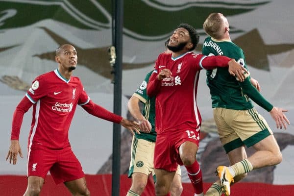 LIVERPOOL, ENGLAND - Saturday, October 24, 2020: Liverpool’s Joe Gomez challenges for a header with Sheffield United's Oliver McBurnie during the FA Premier League match between Liverpool FC and Sheffield United FC at Anfield. The game was played behind closed doors due to the UK government’s social distancing laws during the Coronavirus COVID-19 Pandemic. (Pic by Propaganda)