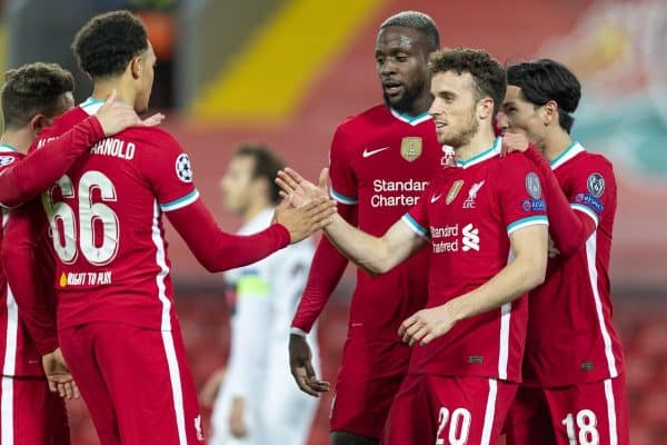 LIVERPOOL, ENGLAND - Tuesday, October 27, 2020: Liverpool's Diogo Jota (C) celebrates with team-mates Divock Origi and Takumi Minamino after scoring the first goal, the club's 10,000th goal, during the UEFA Champions League Group D match between Liverpool FC and FC Midtjylland at Anfield. Liverpool won 2-0. (Pic by David Rawcliffe/Propaganda)