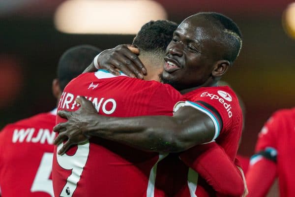 LIVERPOOL, ENGLAND - Sunday, November 22, 2020: Liverpool’s Roberto Firmino (L) celebrates with team-mate Sadio Mané after scoring the third goal during the FA Premier League match between Liverpool FC and Leicester City FC at Anfield. The game was played behind closed doors due to the UK government’s social distancing laws during the Coronavirus COVID-19 Pandemic. Liverpool won 3-0. (Pic by David Rawcliffe/Propaganda)