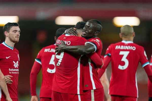 LIVERPOOL, ENGLAND - Sunday, November 22, 2020: Liverpool’s Roberto Firmino (L) celebrates with team-mate Sadio Mané after scoring the third goal during the FA Premier League match between Liverpool FC and Leicester City FC at Anfield. The game was played behind closed doors due to the UK government’s social distancing laws during the Coronavirus COVID-19 Pandemic. Liverpool won 3-0. (Pic by David Rawcliffe/Propaganda)