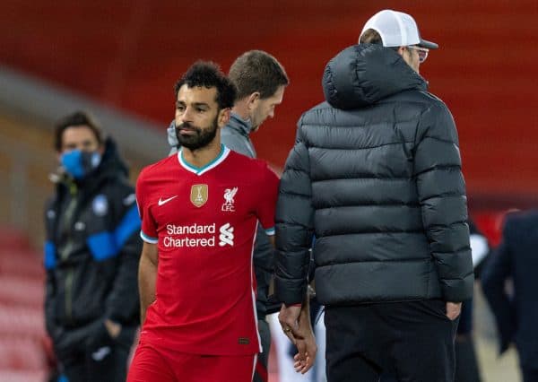 LIVERPOOL, ENGLAND - Wednesday, November 25, 2020: Liverpool's Mohamed Salah (L) walks past manager Jürgen Klopp as he is substituted during the UEFA Champions League Group D match between Liverpool FC and Atalanta BC at Anfield. Atalanta won 2-0. (Pic by David Rawcliffe/Propaganda)