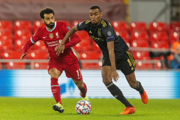 LIVERPOOL, ENGLAND - Tuesday, December 1, 2020: Liverpool's Mohamed Salah (L) tackles Ajax's Ryan Gravenberch during the UEFA Champions League Group D match between Liverpool FC and AFC Ajax at Anfield. Liverpool won 1-0 to win the group and progress to the Round of 16. (Pic by David Rawcliffe/Propaganda)