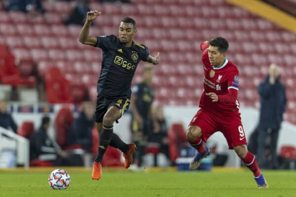 LIVERPOOL, ENGLAND - Tuesday, December 1, 2020: Ajax's Ryan Gravenberch (L) and Liverpool's Roberto Firmino during the UEFA Champions League Group D match between Liverpool FC and AFC Ajax at Anfield. Liverpool won 1-0 to win the group and progress to the Round of 16. (Pic by David Rawcliffe/Propaganda)