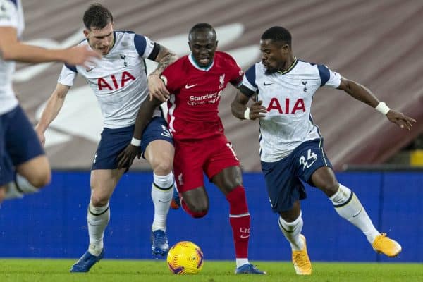 LIVERPOOL, ENGLAND - Wednesday, December 16, 2020: Liverpool's Sadio Mané is tackled by Tottenham Hotspur's Pierre-Emile Højbjerg (L) and Serge Aurier (R) during the FA Premier League match between Liverpool FC and Tottenham Hotspur FC at Anfield. Liverpool won 2-1. (Pic by David Rawcliffe/Propaganda)