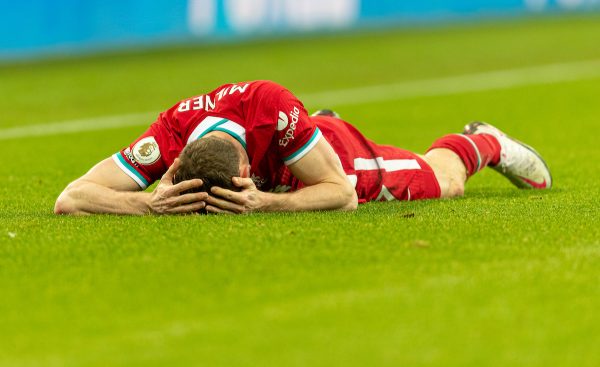 NEWCASTLE-UPON-TYNE, ENGLAND - Wednesday, December 30, 2020: Liverpool’s James Milner goes down with a head injury during the FA Premier League match between Newcastle United FC and Liverpool FC at St. James’ Park. The game ended in a goal-less draw. (Pic by David Rawcliffe/Propaganda)