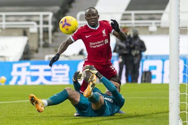 NEWCASTLE-UPON-TYNE, ENGLAND - Wednesday, December 30, 2020: Newcastle United's goalkeeper Karl Darlow grabs Liverpool's Sadio Mané by the leg, but amazingly no penalty was awarded or even a VAR check, during the FA Premier League match between Newcastle United FC and Liverpool FC at St. James’ Park. The game ended in a goal-less draw. (Pic by David Rawcliffe/Propaganda)