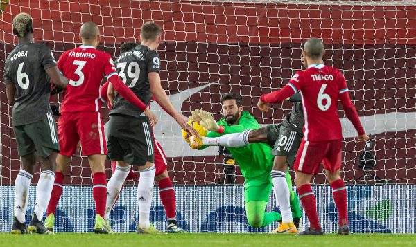 LIVERPOOL, ENGLAND - Sunday, January 17, 2021: Liverpool's goalkeeper Alisson Becker makes a save during the FA Premier League match between Liverpool FC and Manchester United FC at Anfield. The game ended in a 0-0 draw. (Pic by David Rawcliffe/Propaganda)