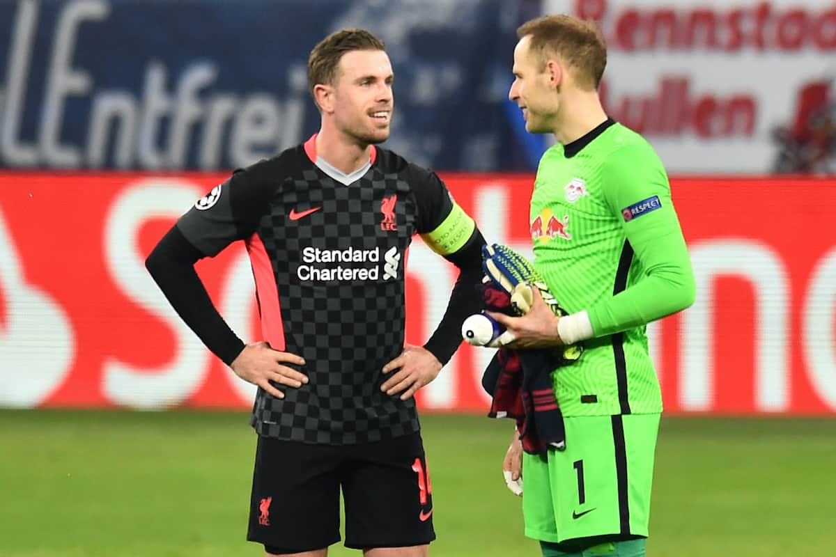 BUDAPEST, HUNGARY - Tuesday, February 16, 2021: Liverpool's captain Jordan Henderson (L) and RB Leipzig's goalkeeper Pe?ter Gula?csi after the UEFA Champions League Round of 16 1st Leg game between RB Leipzig and Liverpool FC at the Puskás Aréna. (Pic by Propaganda)