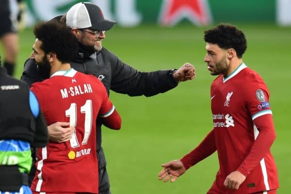 BUDAPEST, HUNGARY - Wednesday, March 10, 2021: Liverpool's manager Jürgen Klopp embraces Mohamed Salah (L) and Alex Oxlade-Chamberlain (R) after the UEFA Champions League Round of 16 2nd Leg game between Liverpool FC and RB Leipzig at the Puskás Aréna. Liverpool won 2-0, 4-0 on aggregate. (Pic by Propaganda)