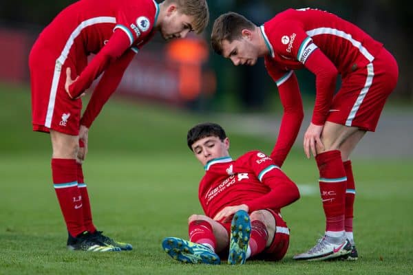 KIRKBY, ENGLAND - Saturday, March 13, 2021: Liverpool's Layton Stewart (C) goes down injured as Jake Cain (L) and captain Ben Woodburn (R) look on during the Premier League 2 Division 1 match between Liverpool FC Under-23's and West Ham United FC Under-23's at the Liverpool Academy. The game ended in a 1-1 draw. (Pic by David Rawcliffe/Propaganda)