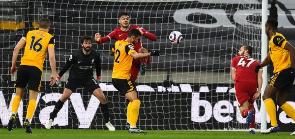 WOLVERHAMPTON, ENGLAND - Monday, March 15, 2021: Liverpool's Ozan Kabak clears the ball during the FA Premier League match between Wolverhampton Wanderers FC and Liverpool FC at Molineux Stadium. Liverpool won 1-0. (Pic by Propaganda)