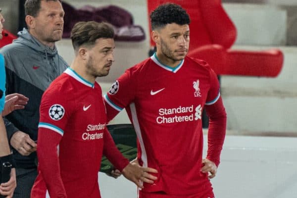 LIVERPOOL, ENGLAND - Wednesday, April 14, 2021: Liverpool's substitutes Xherdan Shaqiri (L) and Alex Oxlade-Chamberlain prepare to come on during the UEFA Champions League Quarter-Final 2nd Leg game between Liverpool FC and Real Madird CF at Anfield. The game ended in a goal-less draw, Real Madrid won 3-1 on aggregate. (Pic by David Rawcliffe/Propaganda)