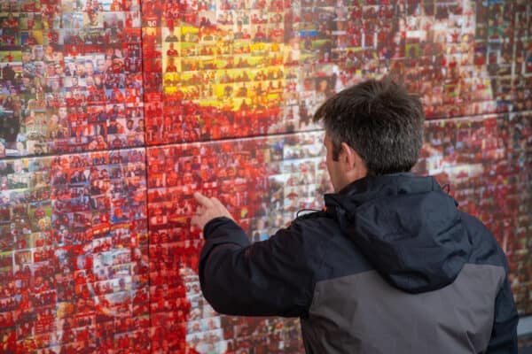 LIVERPOOL, ENGLAND - Sunday, August 8, 2021: A supporter looks at photograophs on the Champions Wall before a pre-season friendly match between Liverpool FC and Athletic Club de Bilbao at Anfield. The game ended in a 1-1 draw. (Pic by David Rawcliffe/Propaganda)