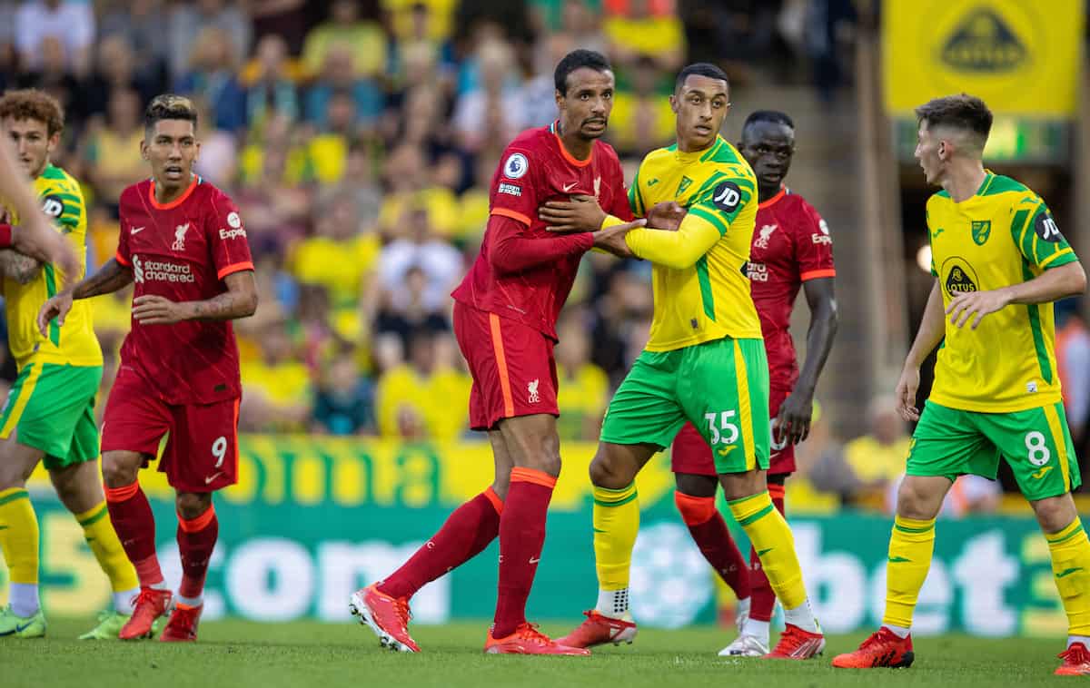 NORWICH, ENGLAND - Saturday, August 14, 2021: Liverpool's Joel Matip (L) and Norwich City's Adam Idah during the FA Premier League match between Norwich City FC and Liverpool FC at Carrow Road. (Pic by David Rawcliffe/Propaganda)
