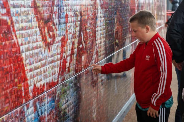 LIVERPOOL, ENGLAND - Saturday, August 21, 2021: Liverpool supporters look at photographs on the Champions Wall before the FA Premier League match between Liverpool FC and Burnley FC at Anfield. Liverpool won 2-0. (Pic by David Rawcliffe/Propaganda)