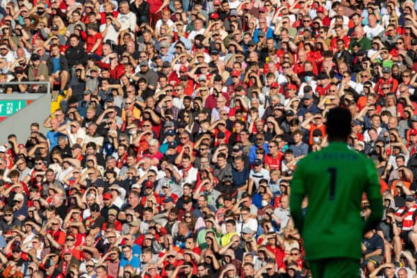 LIVERPOOL, ENGLAND - Saturday, August 28, 2021: Liverpool supporters shield they eyes from the evening sunshine during the FA Premier League match between Liverpool FC and Chelsea FC at Anfield. (Pic by David Rawcliffe/Propaganda)