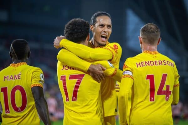 LONDON, ENGLAND - Saturday, September 25, 2021: Liverpool's Curtis Jones (L) celebrates with team-mate Virgil van Dijk after scoring the third goal during the FA Premier League match between Brentford FC and Liverpool FC at the Brentford Community Stadium. (Pic by David Rawcliffe/Propaganda)