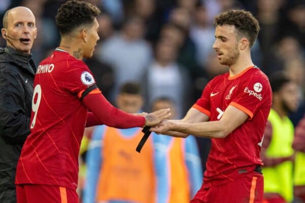 LIVERPOOL, ENGLAND - Sunday, October 3, 2021: Liverpool's substitute Roberto Firmino (L) replaces Diogo Jota during the FA Premier League match between Liverpool FC and Manchester City FC at Anfield. The game ended in a 2-2 draw. (Pic by David Rawcliffe/Propaganda)