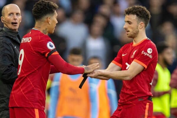 LIVERPOOL, ENGLAND - Sunday, October 3, 2021: Liverpool's substitute Roberto Firmino (L) replaces Diogo Jota during the FA Premier League match between Liverpool FC and Manchester City FC at Anfield. The game ended in a 2-2 draw. (Pic by David Rawcliffe/Propaganda)