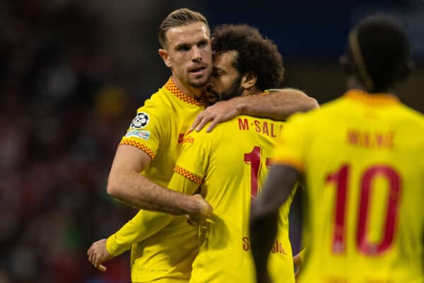 MADRID, SPAIN - Tuesday, October 19, 2021: Liverpool's Mohamed Salah (R) celebrates with team-mate captain Jordan Henderson after scoring the first goal, scoring in his ninth consecutive game, during the UEFA Champions League Group B Matchday 3 game between Club Atlético de Madrid and Liverpool FC at the Estadio Metropolitano. Liverpool won 3-2. (Pic by David Rawcliffe/Propaganda)