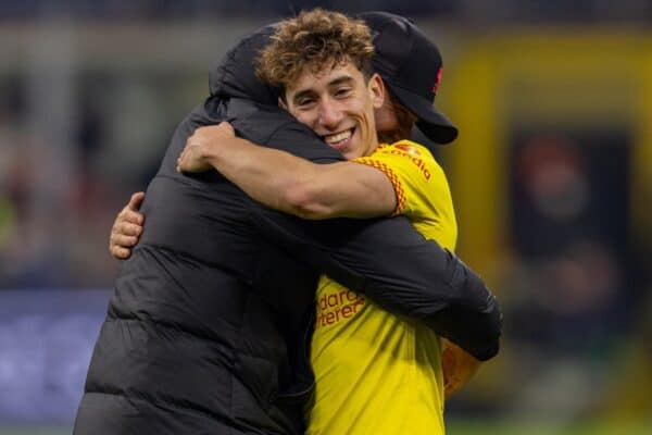 MILAN, ITALY - Tuesday, December 7, 2021: Liverpool's Kostas Tsimikas is embraced by manager Jürgen Klopp after the UEFA Champions League Group B Matchday 6 game between AC Milan and Liverpool FC at the Stadio San Siro. Liverpool won 2-1. (Pic by David Rawcliffe/Propaganda)