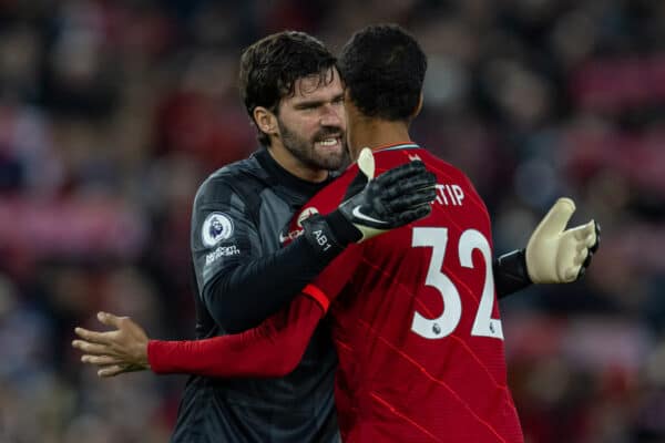 LIVERPOOL, ENGLAND - Thursday, December 16, 2021: Liverpool's goalkeeper Alisson Becker (L) and Joel Matip embrace before the FA Premier League match between Liverpool FC and Newcastle United FC at Anfield. Liverpool won 3-1. (Pic by David Rawcliffe/Propaganda)