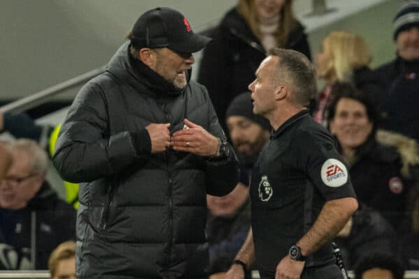 LONDON, ENGLAND - Sunday, December 19, 2021: Liverpool's manager Jürgen Klopp is spoken to by referee Paul Tierney after being shown a yellow card during the FA Premier League match between Tottenham Hotspur FC and Liverpool FC at the Tottenham Hotspur Stadium. The game ended in a 2-2 draw. (Pic by David Rawcliffe/Propaganda)