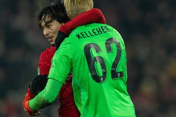 LIVERPOOL, ENGLAND - Wednesday, December 22, 2021: Liverpool's goalkeeper Caoimhin Kelleher is embraced by Takumi Minamino after the penalty shoot-out during the Football League Cup Quarter-Final match between Liverpool FC and Leicester City FC at Anfield. Liverpool won 5-4 on penalties after a 3-3 draw. (Pic by David Rawcliffe/Propaganda)
