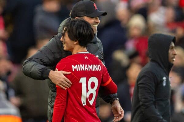 LIVERPOOL, ENGLAND - Sunday, January 16, 2022: Liverpool's manager Jürgen Klopp embraces Takumi Minamino after the FA Premier League match between Liverpool FC and Brentford FC at Anfield.  Liverpool won 3-0.  (Pic by David Rawcliffe / Propaganda)