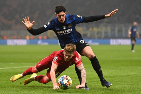 MILAN, ITALY - Tuesday, February 15, 2022: Liverpool's Harvey Elliott is challenged by FC Internazionale Milano’s Alessandro Bastoni during the UEFA Champions League Round of 16 1st Leg game between FC Internazionale Milano and Liverpool FC at the Stadio San Siro. (Handout photo by UEFA)