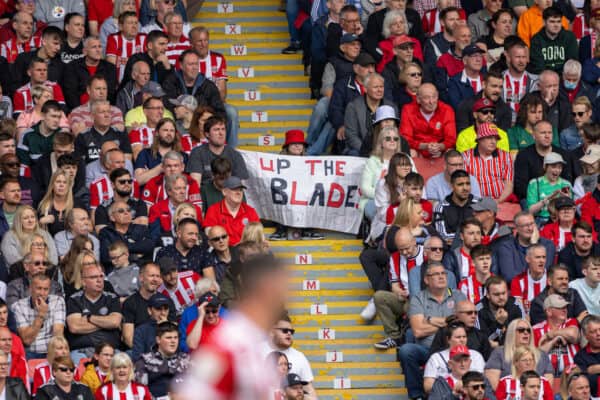 SHEFFIELD, ENGLAND - Saturday, May 7, 2022: A young Sheffield United supporter with a banner "Up The Blades" during the Football League Championship match between Sheffield United FC and Fulham FC at Bramall Lane. (Pic by David Rawcliffe/Propaganda)