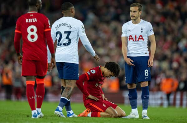 LIVERPOOL, ENGLAND - Saturday, May 7, 2022: Liverpool's Trent Alexander-Arnold (C) on his knees at the final whistle as Tottenham Hotspur's Harry Winks (R) and Steven Bergwijn (L) shake hands during the FA Premier League match between Liverpool FC and Tottenham Hotspur FC at Anfield. The game ended in a 1-1 draw. (Pic by David Rawcliffe/Propaganda)