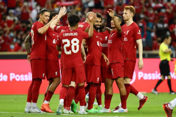 SINGAPORE - Friday, July 15, 2022: Liverpool's Mohamed Salah celebrates with team-mates after scoring the second goal during the Standard Chartered Trophy pre-season friendly match between Liverpool FC and Crystal Palace FC at the Singapore National Stadium. (Handout Photo by Full Circle PR)