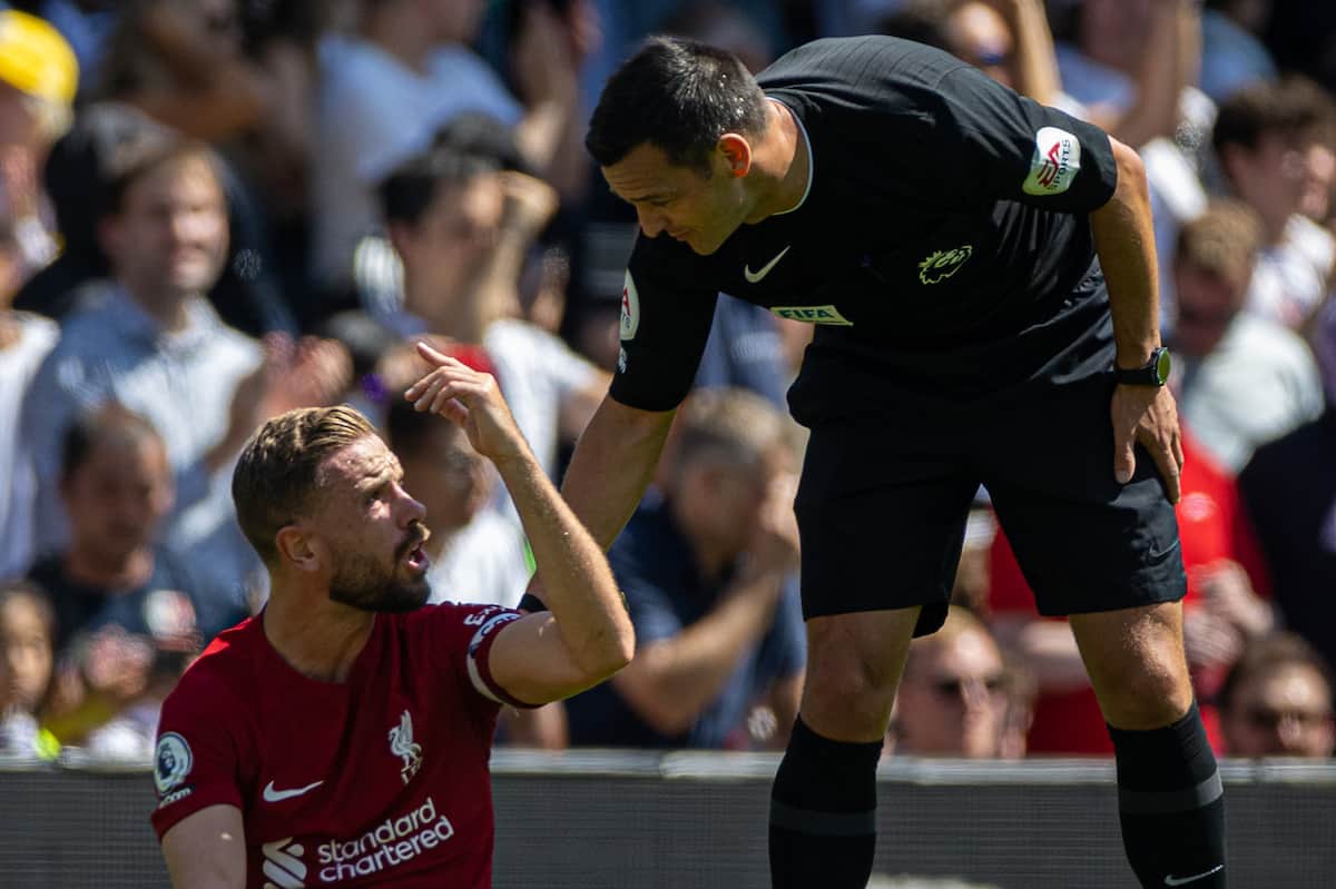 LONDON, ENGLAND - Saturday, August 6, 2022: Liverpool's captain Jordan Henderson sits injured as referee Andy Madley looks on during the FA Premier League match between Fulham FC and Liverpool FC at Craven Cottage. The game ended in a 2-2 draw. (Pic by David Rawcliffe/Propaganda)