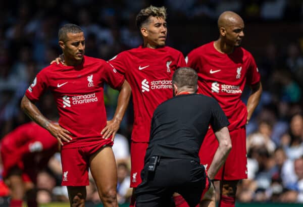 LONDON, ENGLAND - Saturday, August 6, 2022: Liverpool's Thiago Alcântara (L) is consoled by team-mate Roberto Firmino (C) after sustaining a hamstring injury during the FA Premier League match between Fulham FC and Liverpool FC at Craven Cottage. The game ended in a 2-2 draw. (Pic by David Rawcliffe/Propaganda)