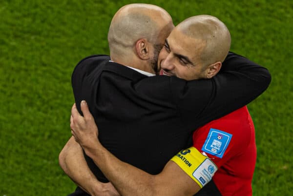 DOHA, QATAR - Saturday, December 10, 2022: Morocco's head coach Walid Regragui (L) embraces caption Sofyan Amrabat after the FIFA World Cup Qatar 2022 Quarter-Final match between Morocco and Portugal at the Al Thumama Stadium. Morocco won 1-0. (Pic by David Rawcliffe/Propaganda)