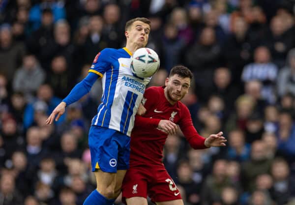 BRIGHTON & HOVE, ENGLAND - Sunday, January 29, 2023: Brighton & Hove Albion's Solly March (L) challenges for a header with Liverpool's Andy Robertson during the FA Cup 4th Round match between Brighton & Hove Albion FC and Liverpool FC at the Falmer Stadium. Brighton won 2-1. (Pic by David Rawcliffe/Propaganda)