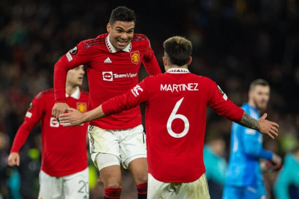 MANCHESTER, ENGLAND - Thursday, February 23, 2023: Manchester United's Carlos Henrique Casimiro (L) and Lisandro Martínez celebrate at the final whistle during the UEFA Europa League Play-Off 2nd Leg game between Manchester United FC and FC Barcelona at Old Trafford. Man Utd won 2-1, 4-3 on aggregate. (Pic by David Rawcliffe/Propaganda)